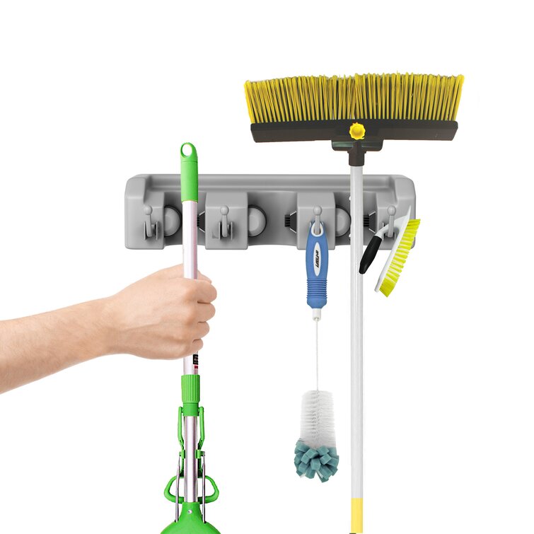 Utility rack for brooms and online mops